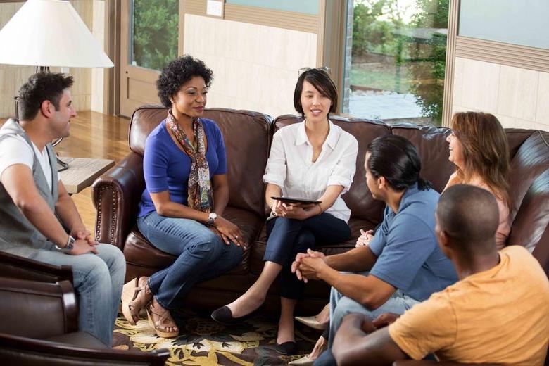 group discussion with everyone sitting and talking